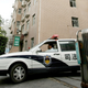 A judicial affair office car drives out at an office-apartment building where a young Canadian model Diana O'Brien was found dead Wednesday, July 9, 2008 in Shanghai, China. An official in the news department of Shanghai's Public Security Bureau said that police got an emergency call early Monday about the death of O'Brien. Police said Wednesday they suspect she was murdered. (AP Photo/Eugene Hoshiko